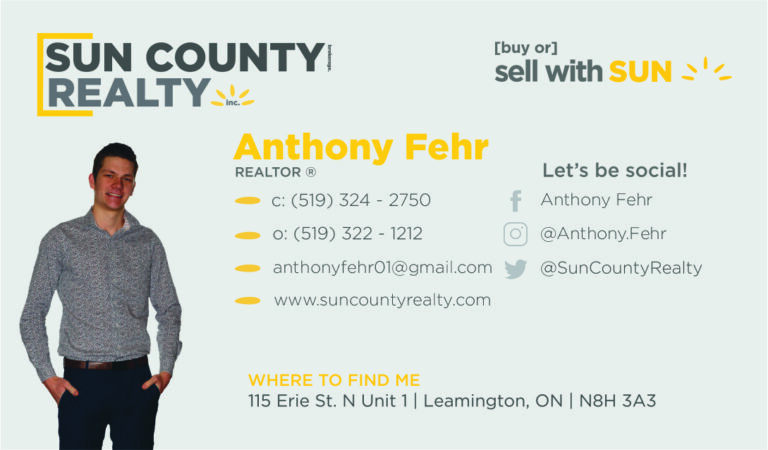 A business card for an agent in the sun county realty.