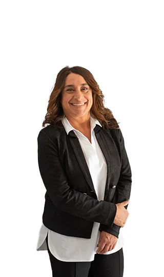 A woman in black jacket and white shirt smiling.